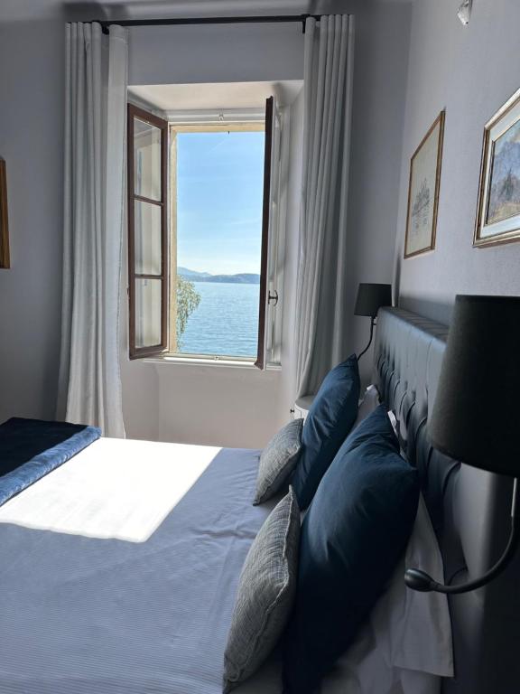 Postel nebo postele na pokoji v ubytování Villa Toscanini