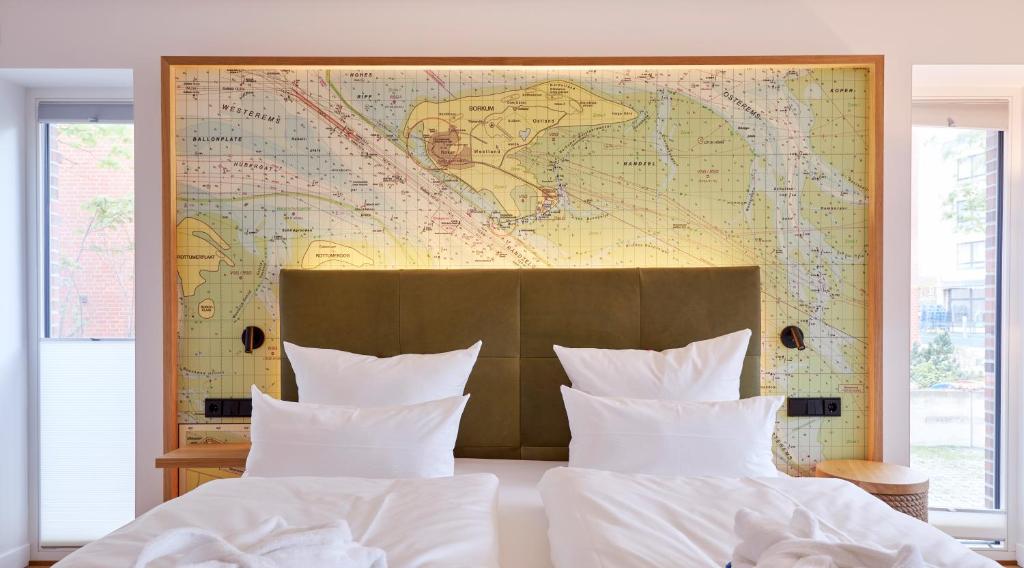 Postel nebo postele na pokoji v ubytování Hotel Villa Düne