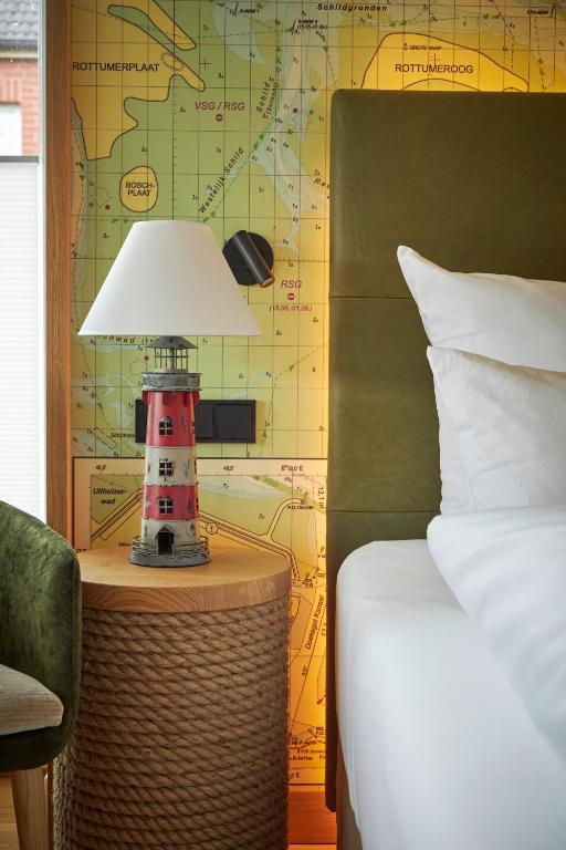 Postel nebo postele na pokoji v ubytování Hotel Villa Düne