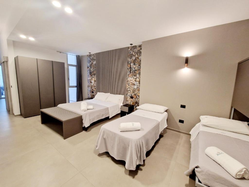 Postel nebo postele na pokoji v ubytování Marebed Apartments & Rooms