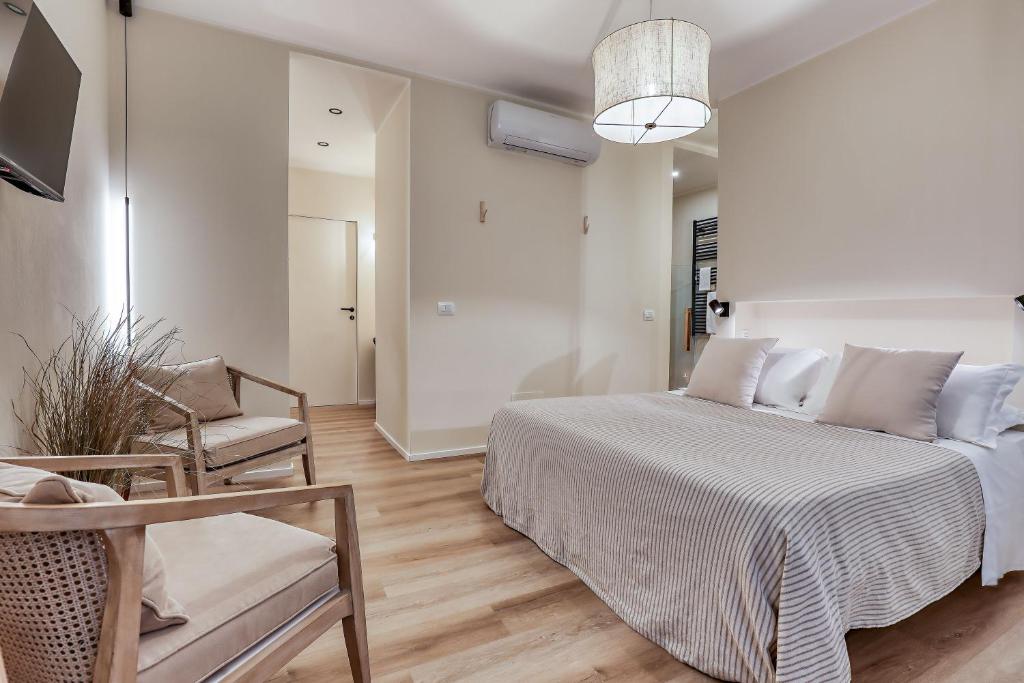 Postel nebo postele na pokoji v ubytování Welchome - Suites