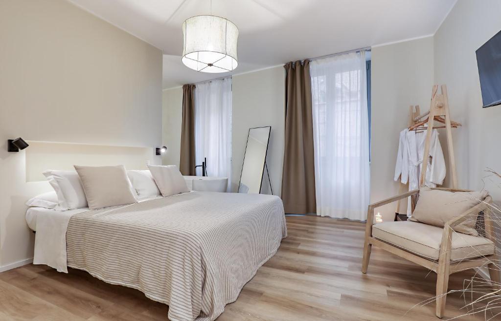 Postel nebo postele na pokoji v ubytování Welchome - Suites