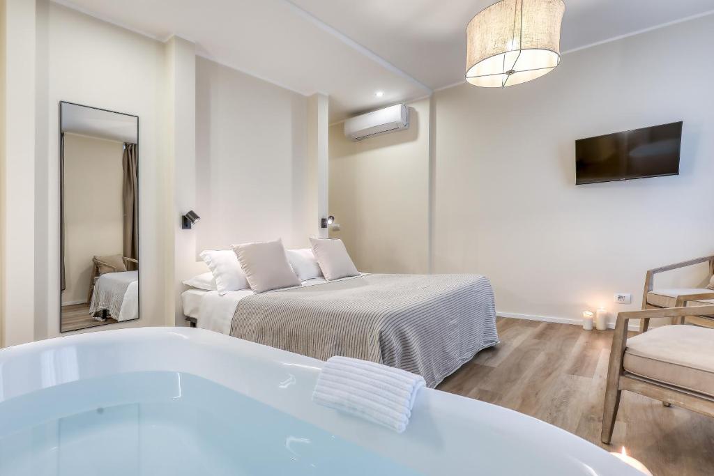 Postel nebo postele na pokoji v ubytování Welchome - Suites