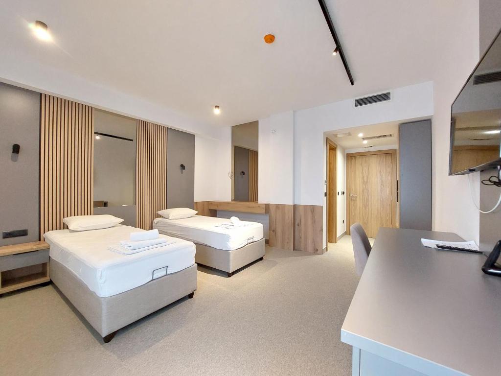 Postel nebo postele na pokoji v ubytování Hotel Almanas