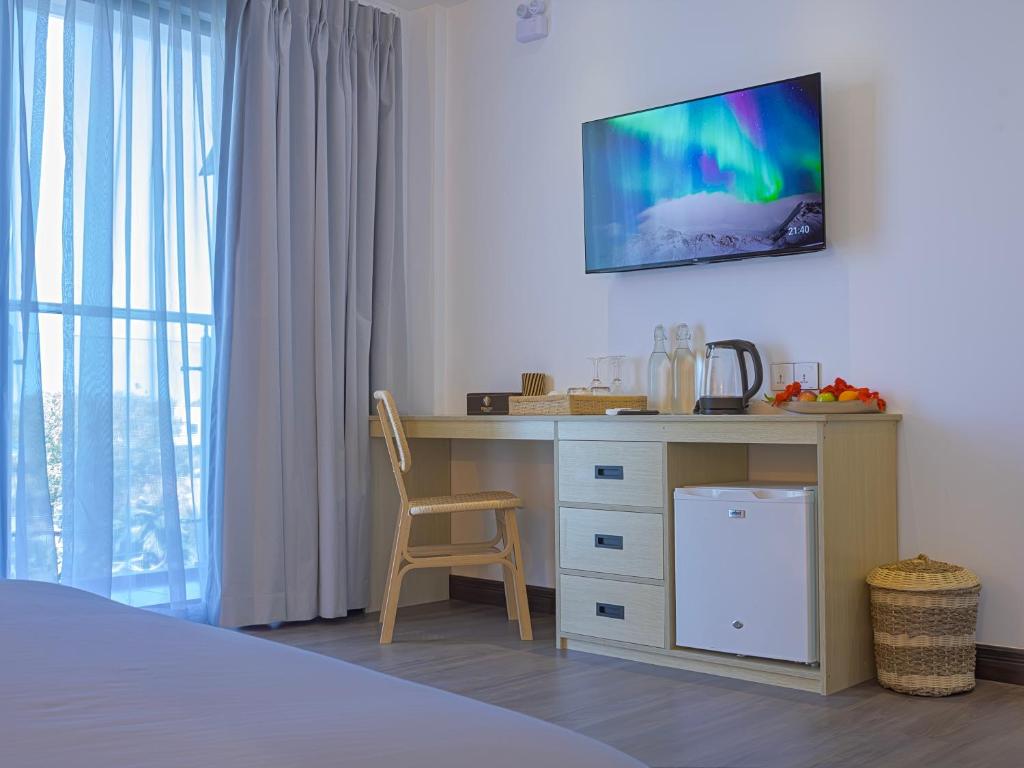 Postel nebo postele na pokoji v ubytování Ithaa Inn Kamadhoo