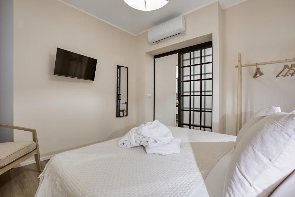 Postel nebo postele na pokoji v ubytování Welchome - Suites