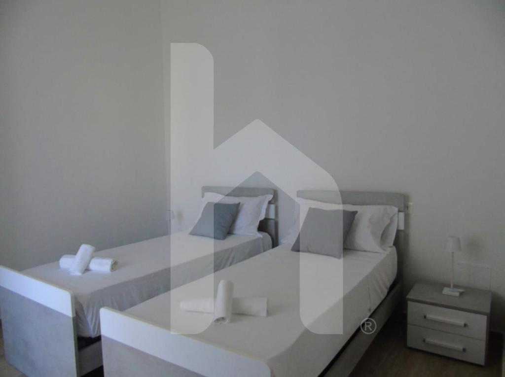 Postel nebo postele na pokoji v ubytování Homiday - Residenza Tulipani