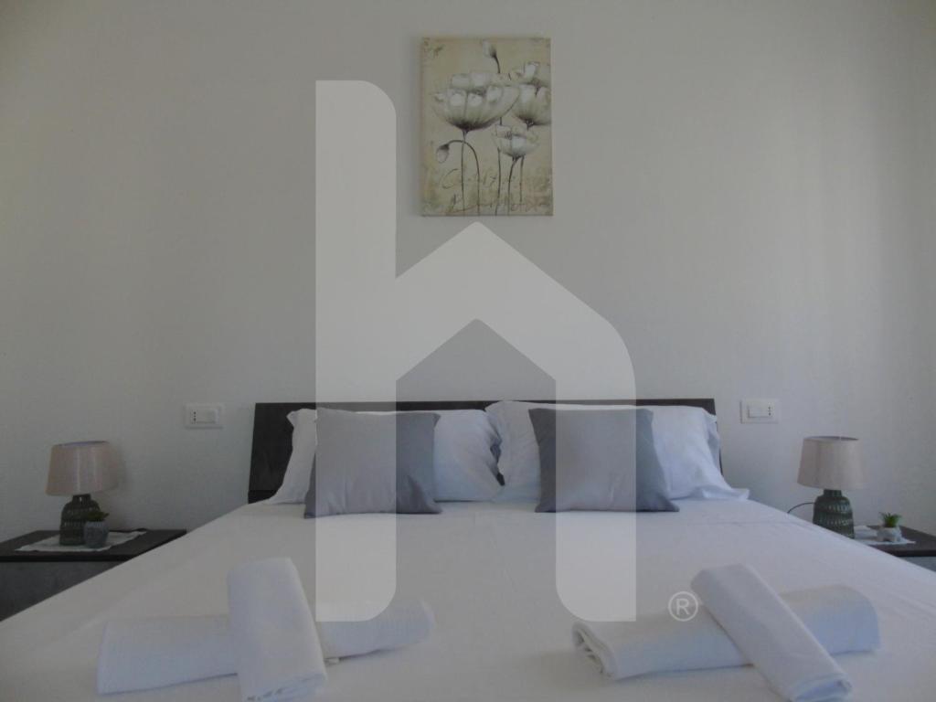 Postel nebo postele na pokoji v ubytování Homiday - Residenza Tulipani