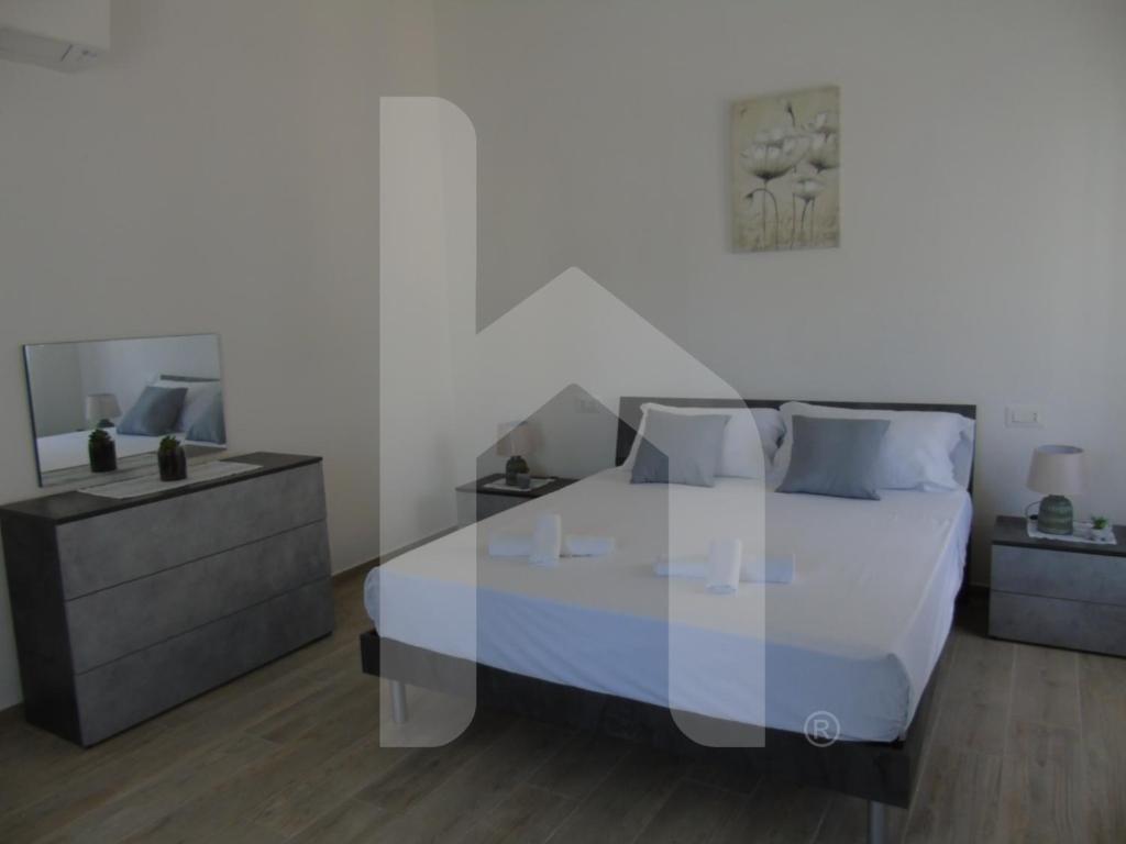 Postel nebo postele na pokoji v ubytování Homiday - Residenza Tulipani