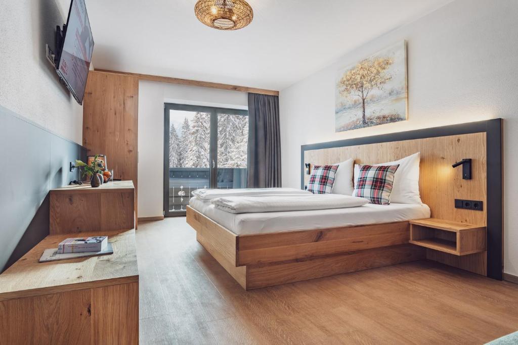 Postel nebo postele na pokoji v ubytování Hotel Bad Neunbrunnen am Waldsee - non Halal