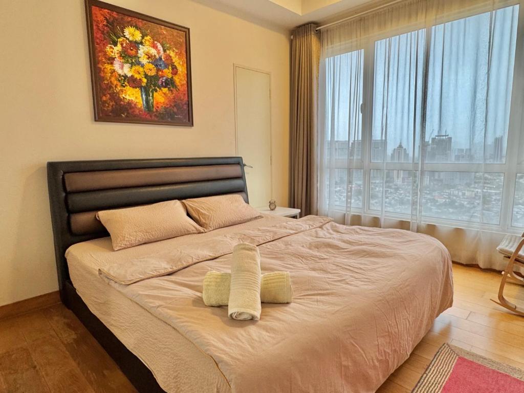 Postel nebo postele na pokoji v ubytování HaBiBi hOmE Klcc