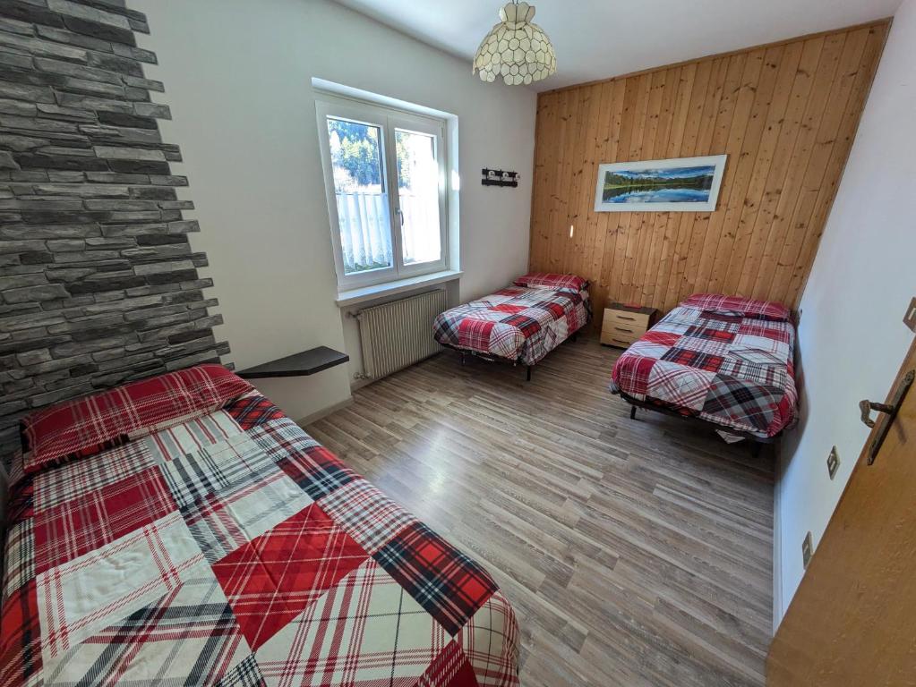 Postel nebo postele na pokoji v ubytování Apartments Giovannini