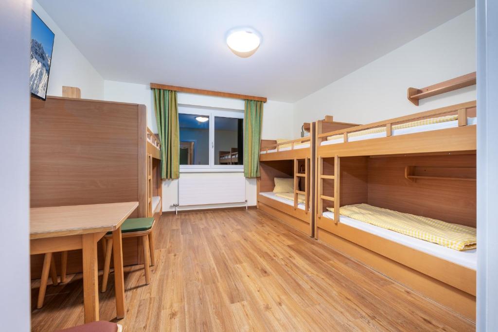 Postel nebo postele na pokoji v ubytování Planner Alpenhof