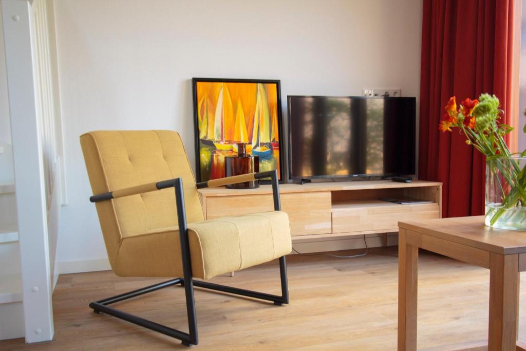 TV a/nebo společenská místnost v ubytování ParelDuyn