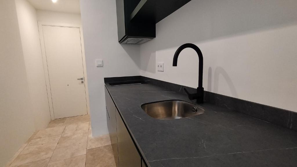 Kuchyňa alebo kuchynka v ubytovaní Hotel Viento10