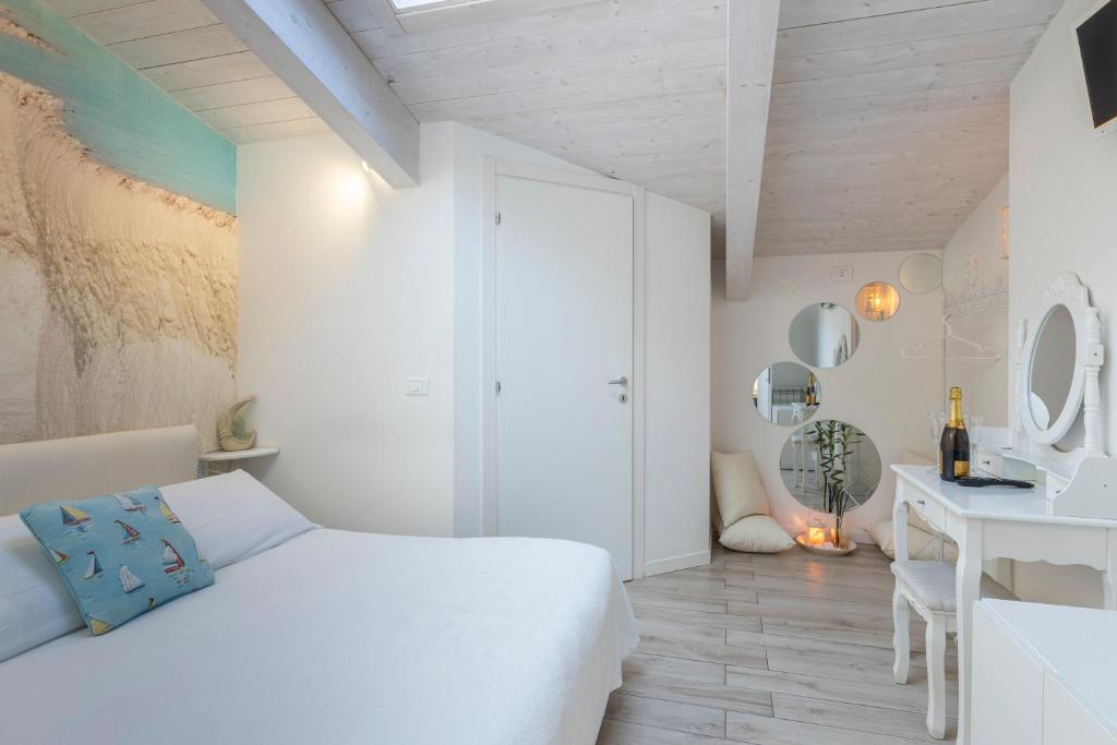 TV a/nebo společenská místnost v ubytování Acquamarina b&b