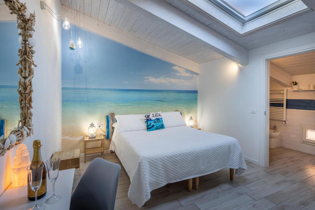 Postel nebo postele na pokoji v ubytování Acquamarina b&b