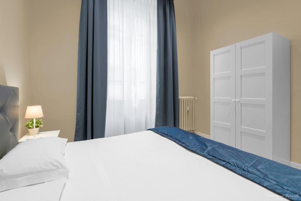 Letto o letti in una camera di B&B Le Stanze del Duomo
