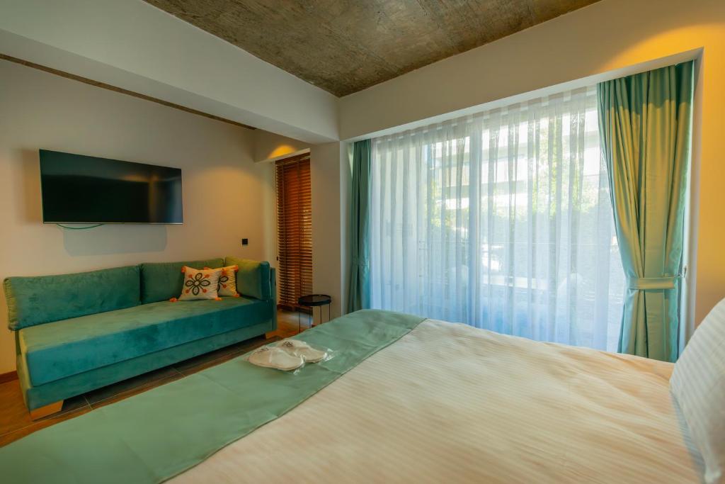 Postel nebo postele na pokoji v ubytování Nakas Hotel