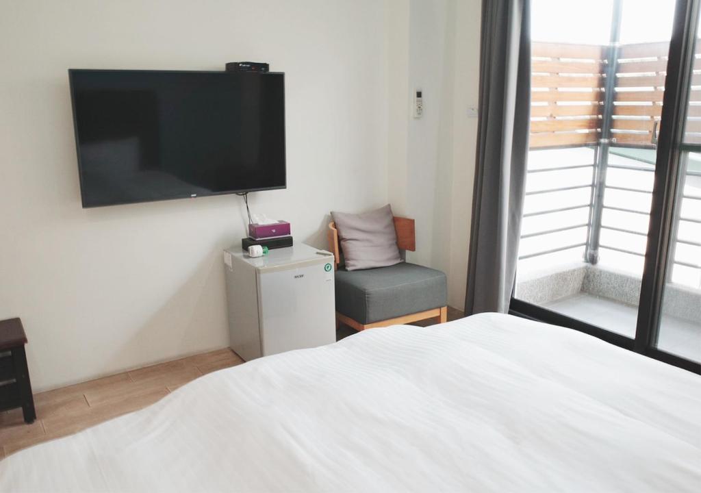 Postel nebo postele na pokoji v ubytování Happy Guesthouse