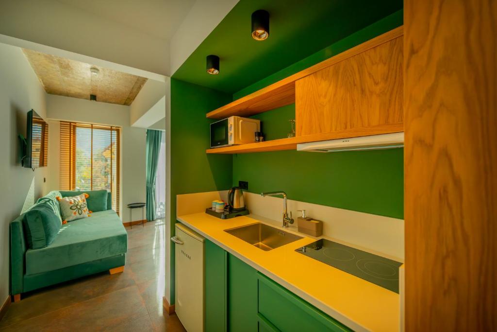 Kuchyň nebo kuchyňský kout v ubytování Nakas Hotel