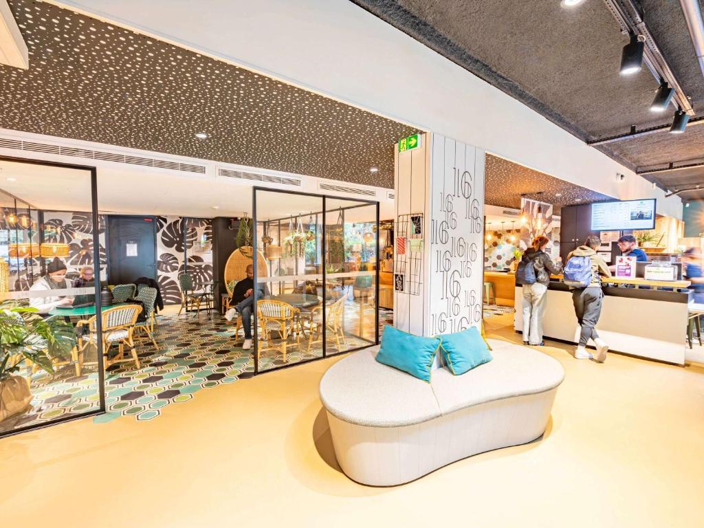 a store with a chair in the middle of a room at ibis Styles Paris 16 Boulogne in Paris