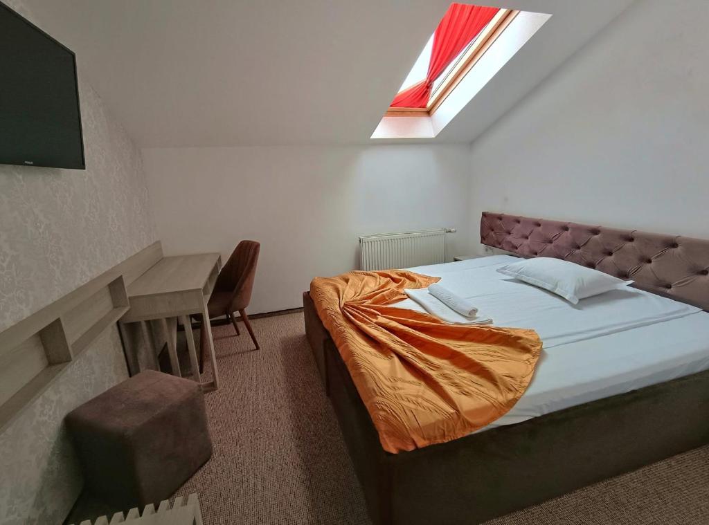 Postel nebo postele na pokoji v ubytování Hotel Alexis