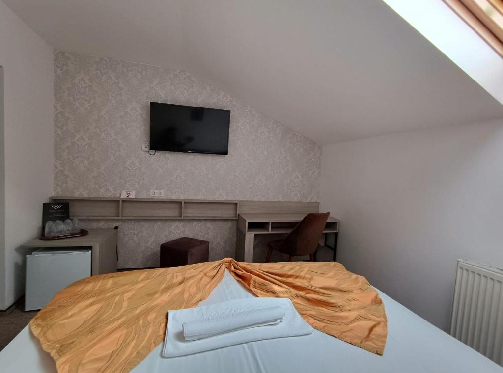 Postel nebo postele na pokoji v ubytování Hotel Alexis