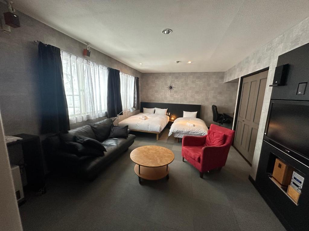 Letto o letti in una camera di Hakuba Third Place Lodge