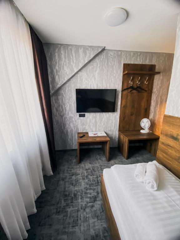 Postel nebo postele na pokoji v ubytování Hotel Petra