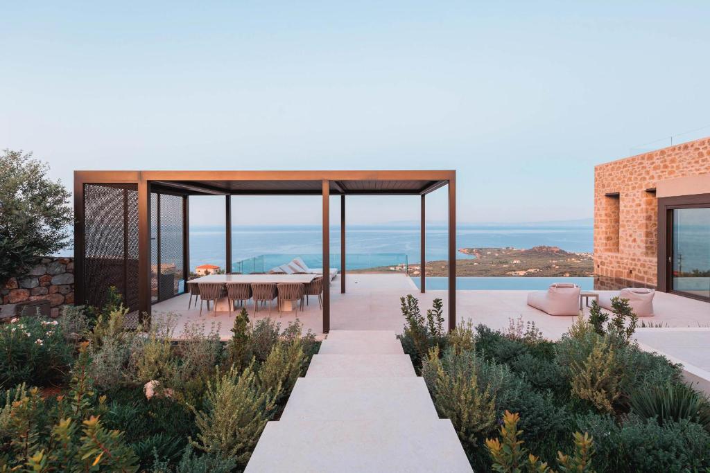 a house with a view of the ocean at Thea Marre in Neokhórion