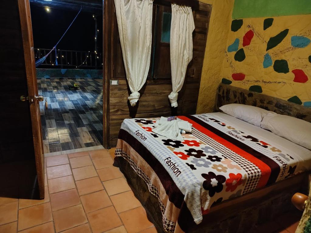 Postel nebo postele na pokoji v ubytování Hotel El Santuario
