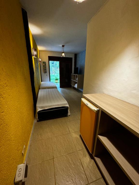 Cama ou camas em um quarto em Pousada Baobá