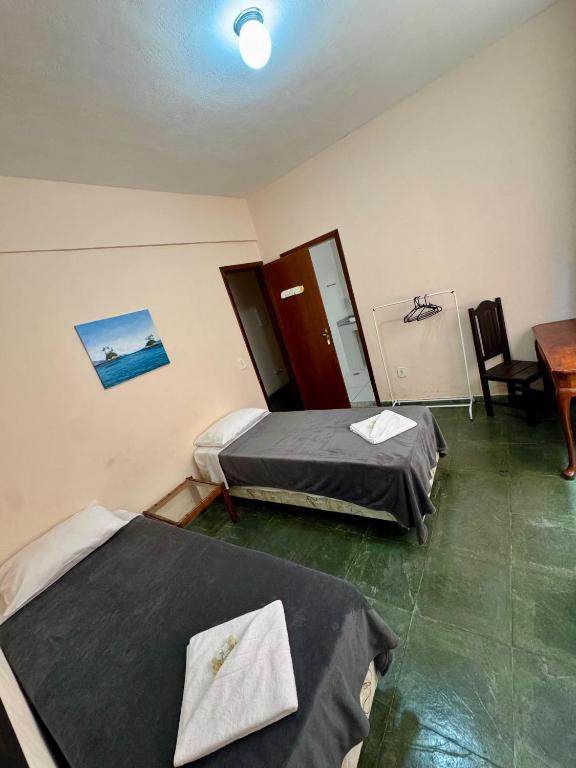 Postel nebo postele na pokoji v ubytování A S Suites