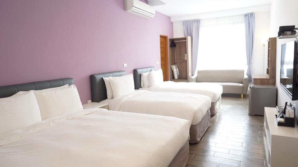 Postel nebo postele na pokoji v ubytování Lukang Holiday Hostel