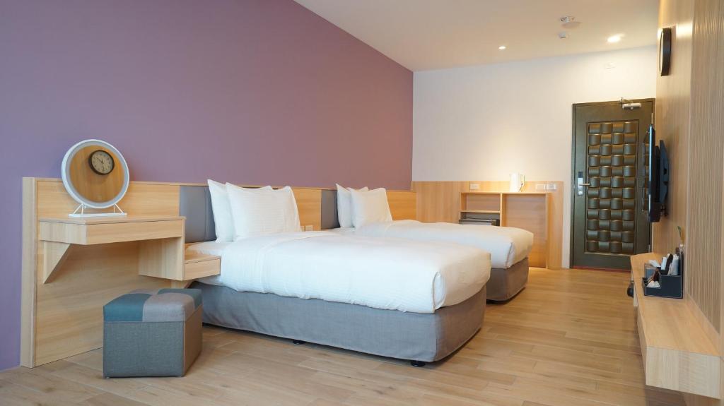 Postel nebo postele na pokoji v ubytování Lukang Holiday Hostel