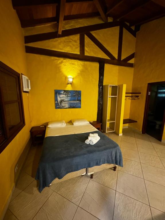 Cama ou camas em um quarto em Pousada Baobá