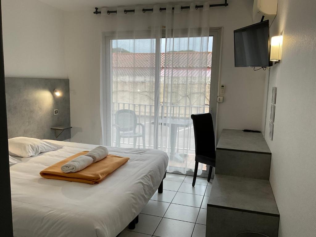 Postel nebo postele na pokoji v ubytování Acapella Hotel