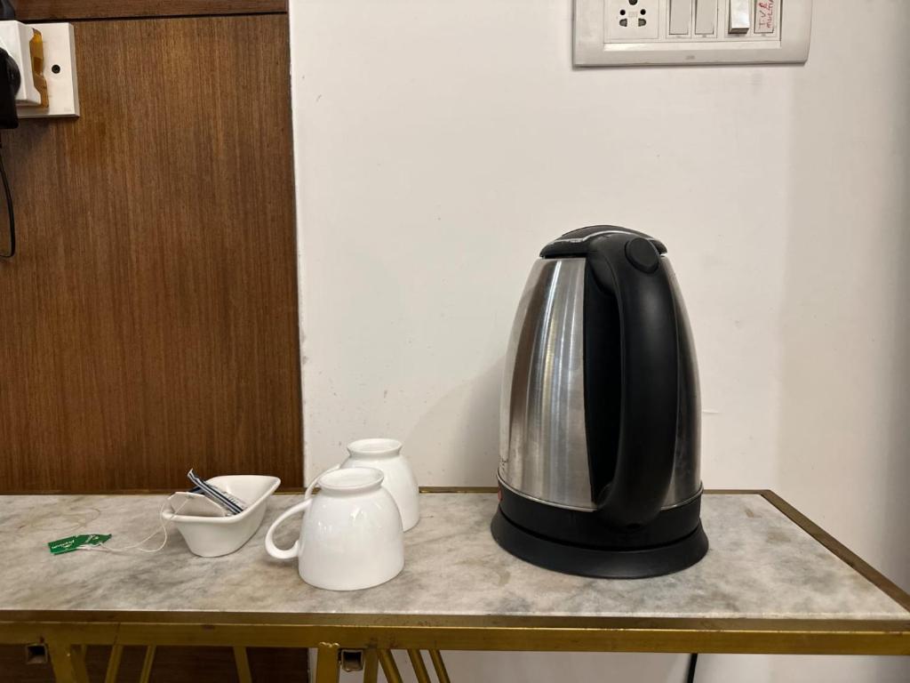 Příslušenství pro přípravu čaje a kávy v ubytování Hotel Blueberry