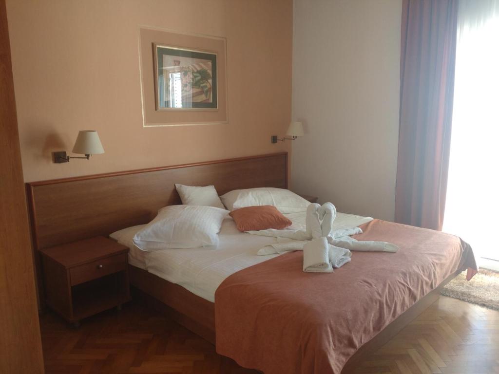 Posteľ alebo postele v izbe v ubytovaní Guest House Palme