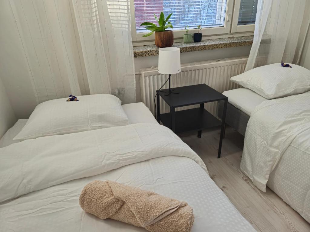 Postel nebo postele na pokoji v ubytování M&J Apartments Centrum