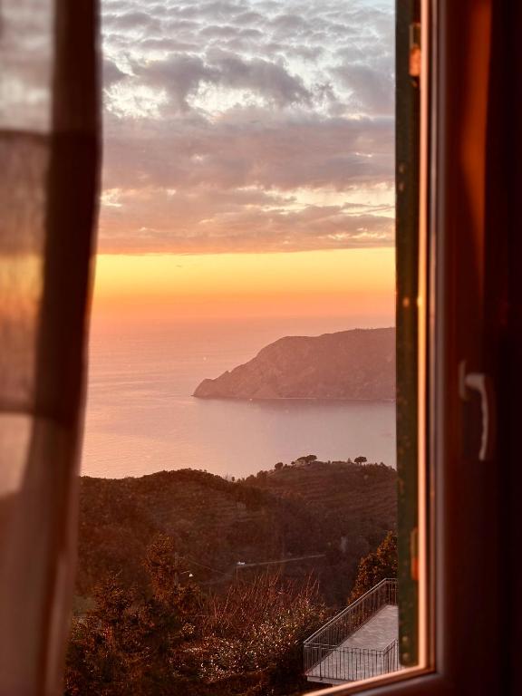 a view of the ocean from a window at Appartamento Luca e Giulia in San Bernardino