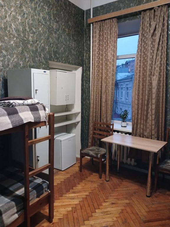 Postel nebo postele na pokoji v ubytování ВВ-ХОСТЕЛ