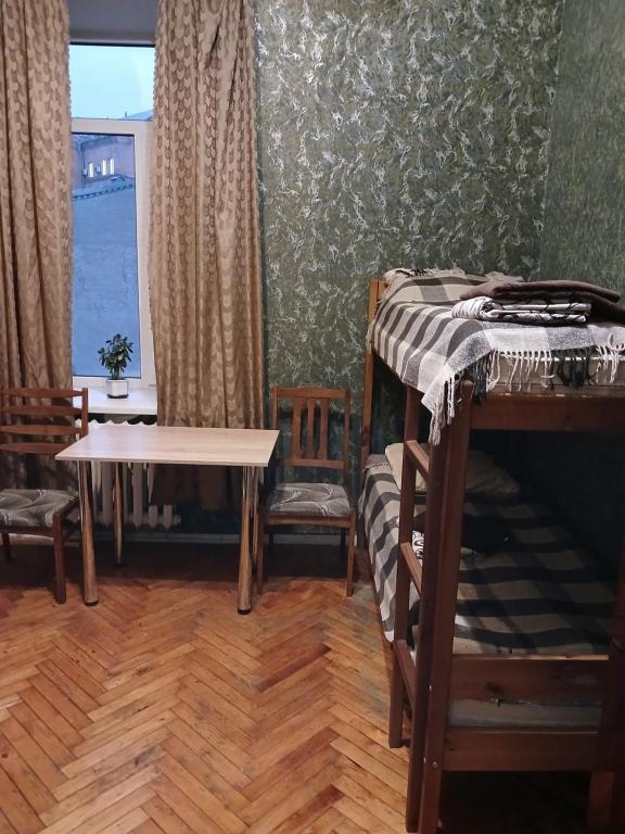 Postel nebo postele na pokoji v ubytování ВВ-ХОСТЕЛ
