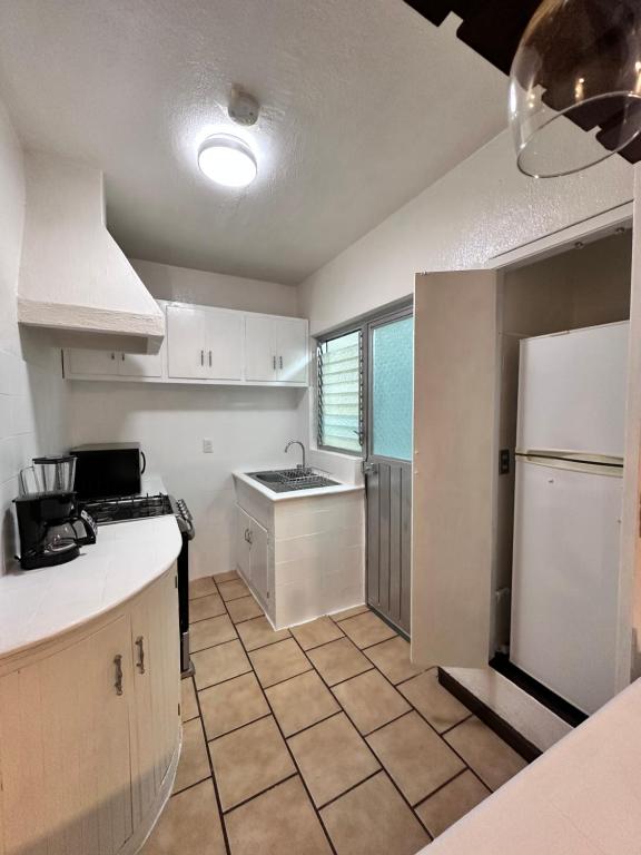Kuchyň nebo kuchyňský kout v ubytování Central Petit Apartment