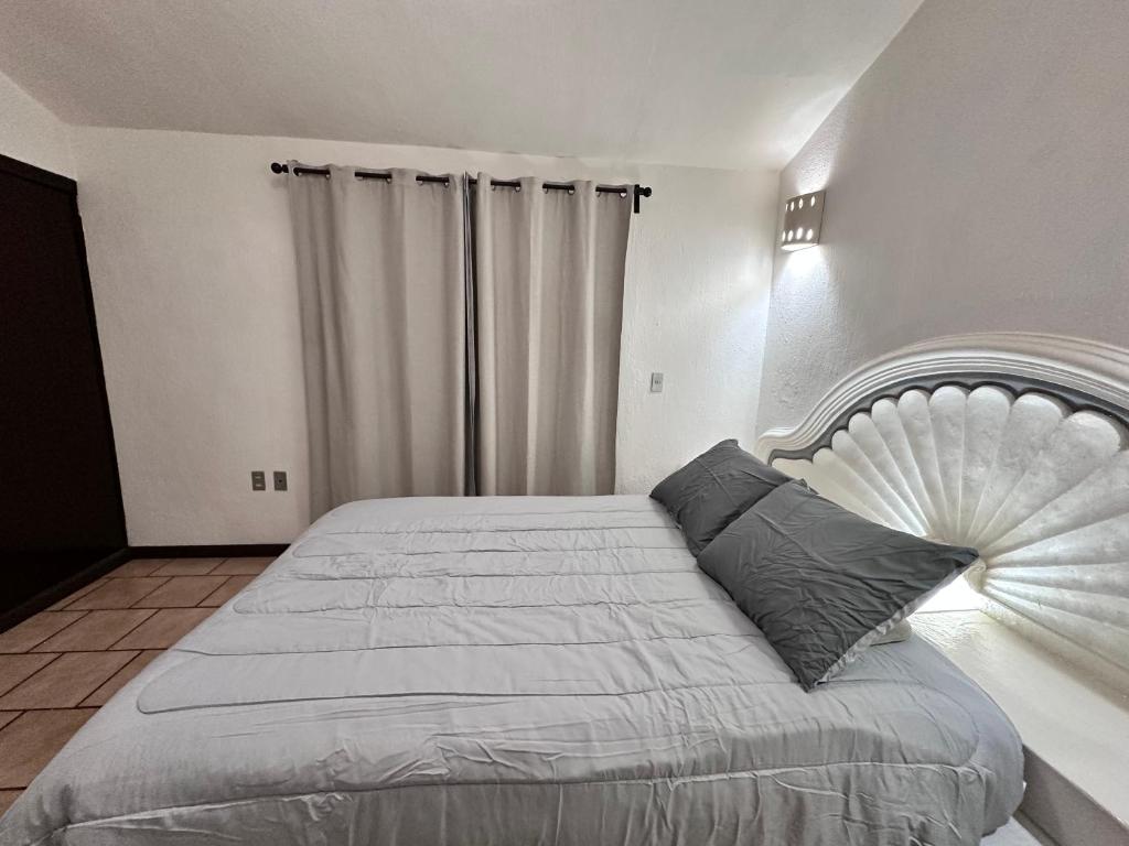 Postel nebo postele na pokoji v ubytování Central Petit Apartment