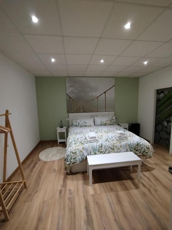 a bedroom with a bed and a painting on the wall at Tuty in Málaga