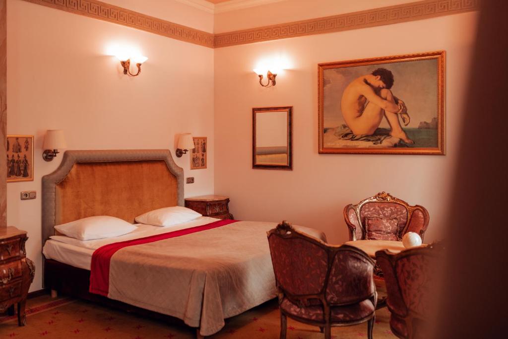 Postel nebo postele na pokoji v ubytování Hotel Ambasada Bolesławiec