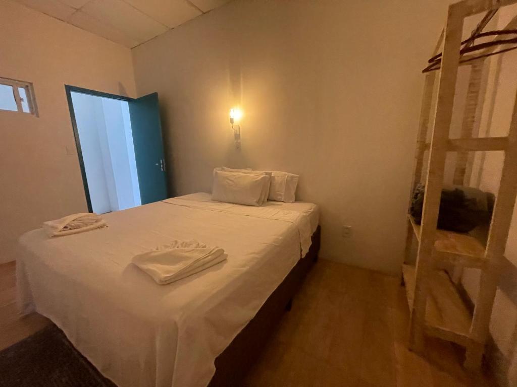 Postel nebo postele na pokoji v ubytování Grand'Hostel