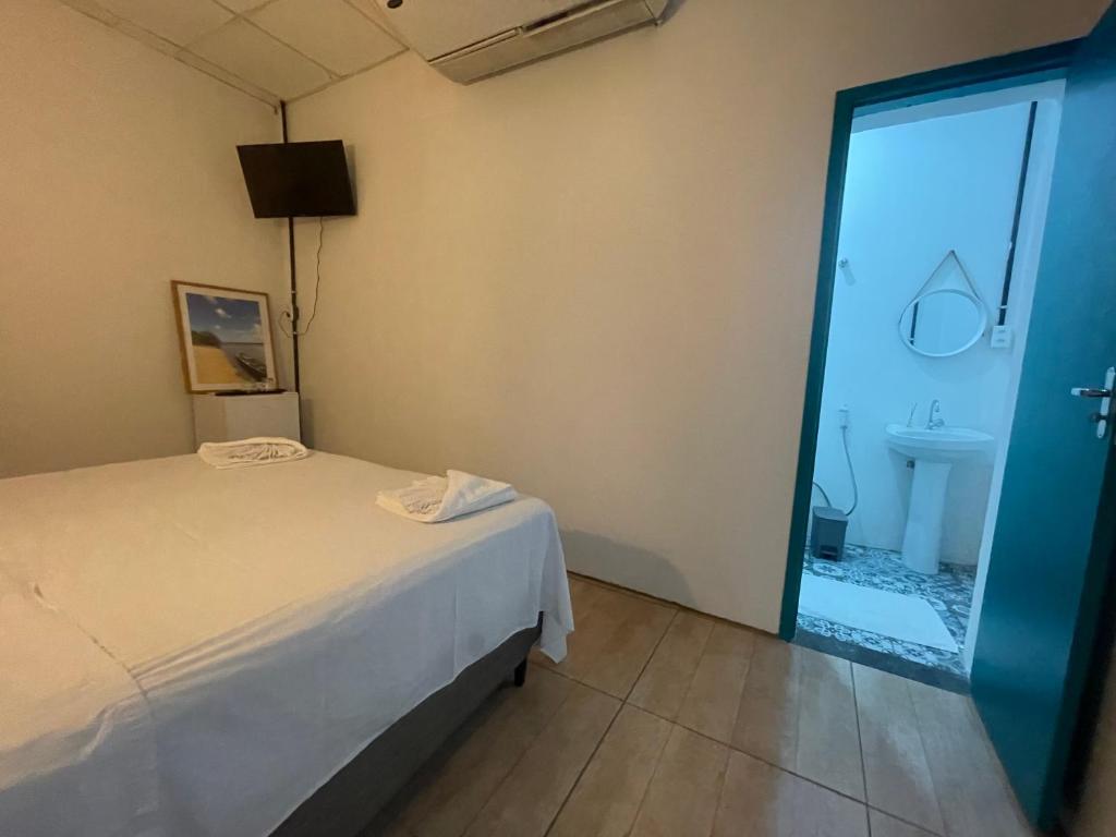 Postel nebo postele na pokoji v ubytování Grand'Hostel